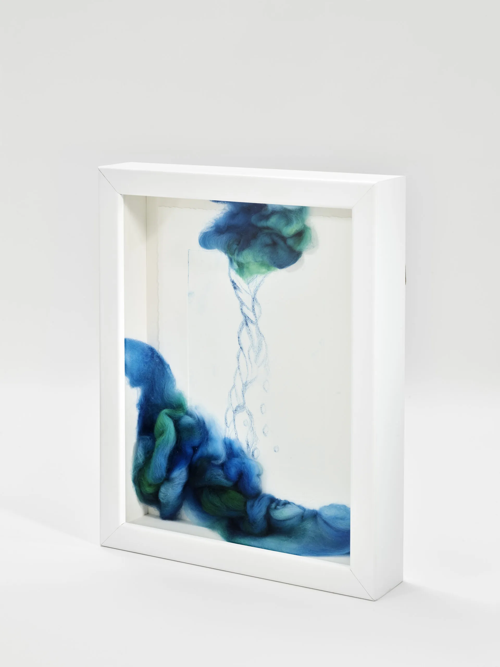 "Every Drop Counts, Edition I". 2025. 14" x 12" x 3" Each. Manually altered etching on paper, wool roving and stitching in acrylic shadow box.