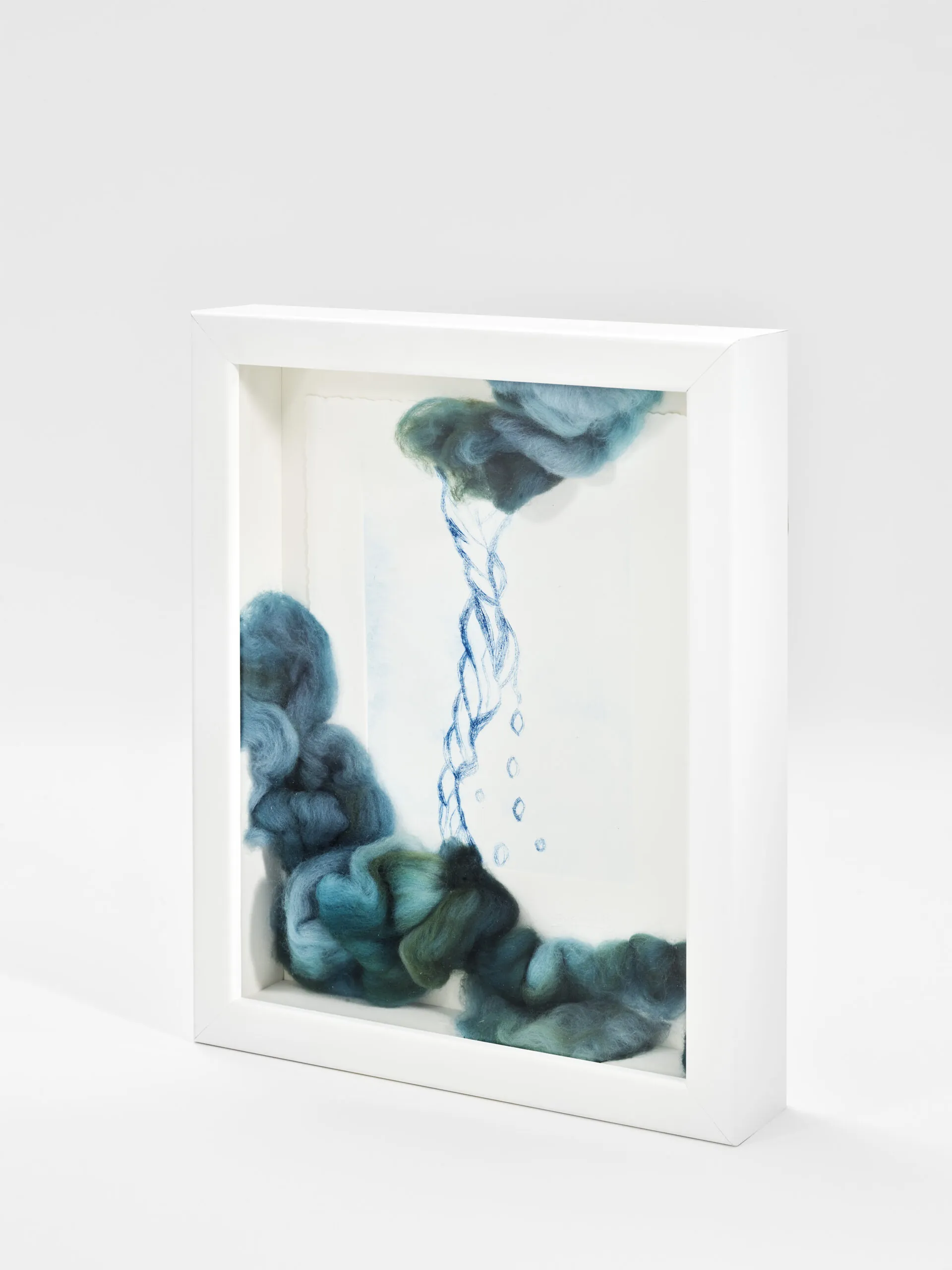 "Every Drop Counts, Edition I". 2025. 14" x 12" x 3" Each. Manually altered etching on paper, wool roving and stitching in acrylic shadow box.