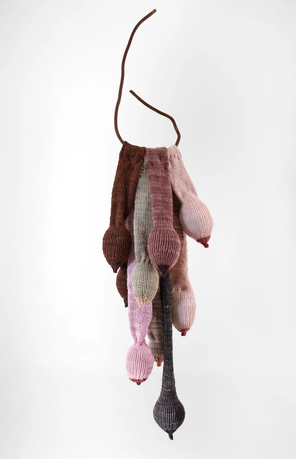 "Free to Hang." 2020. Hand knit breast forms mounted on rebar. 50" x 10" x 8"
