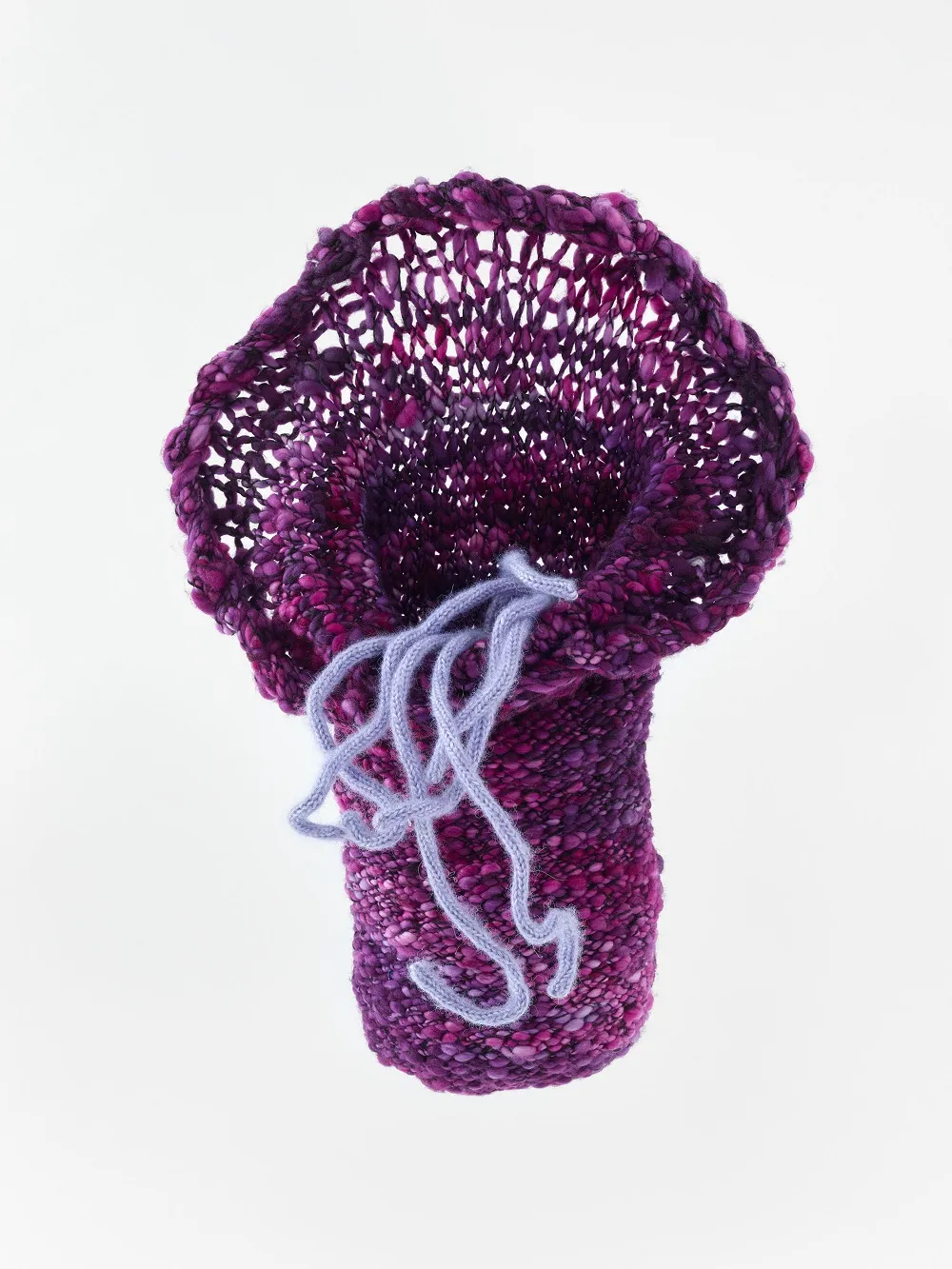 Hand knit artwork with wool yarn.
